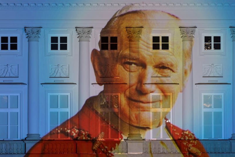 A picture of Pope John Paul II is displayed on the facade of the Presidential Palace in Warsaw, Poland. Reuters