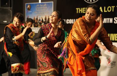 Participants performing giddha, a popular women's folk dance in the Punjab region in India. Pawan Singh / The National