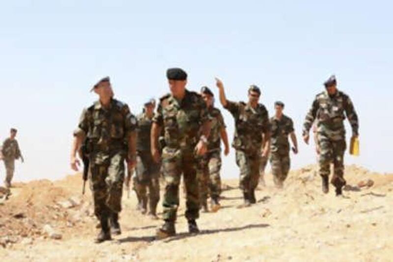 Lebanese army and United Nations officers inspect a former Israel position bordering the Israeli-occupied Shebaa Farms on July 14, 2008.