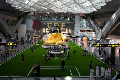 Passengers at Hamad International Airport in Doha. PA