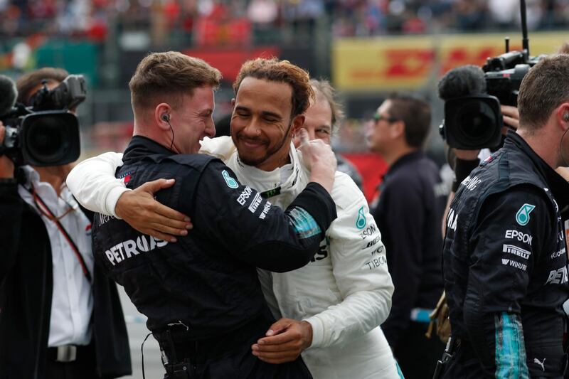Lewis Hamilton celebrates with a member of his crew. AP Photo
