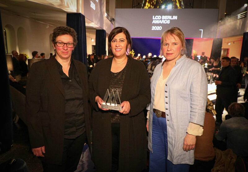 Manal Ataya, centre, holds an LCD Berlin award after the Sharjah Museums Authority won for Best Cultural Collaboration. Courtesy Wam