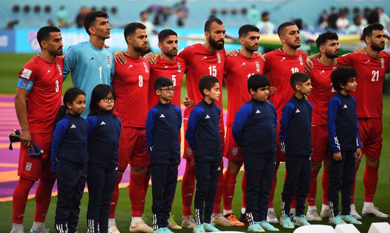 Players of Iran stand during their national anthem prior to the FIFA World Cup 2022 group B soccer match between England and Iran. EPA