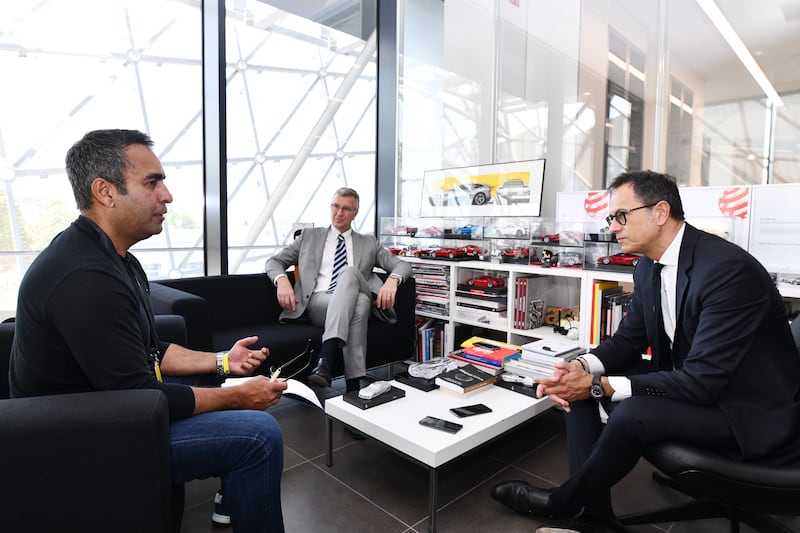 Carando, middle, with Ferrari design director Flavio Manzoni, right, and Gautam Sharma for The National.