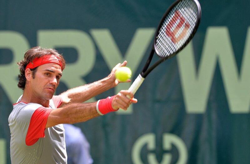 Roger Federer shown during his second round win at the Gerry Weber Open over Joao Sousa on Thursday. Carmen Jaspersen / AFP / June 12, 2014 