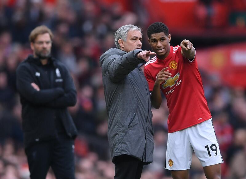 MANCHESTER, ENGLAND - MARCH 10:  Jose Mourinho of Manchester United speaks to Marcus Rashford as Jurgen Klopp of Liverpool looks on during the Premier League match between Manchester United and Liverpool at Old Trafford on March 10, 2018 in Manchester, England.  (Photo by Laurence Griffiths/Getty Images)