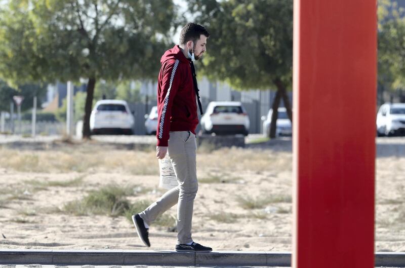 DUBAI, UNITED ARAB EMIRATES , January 5 – 2021 :- People wearing warm clothes during the winter season in Motor City area in Dubai. (Pawan Singh / The National) For News/Stock/Online.