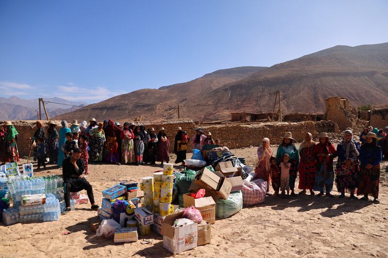 Women queue for humanitarian aid in Ighil Ntalghoumt. Reuters
