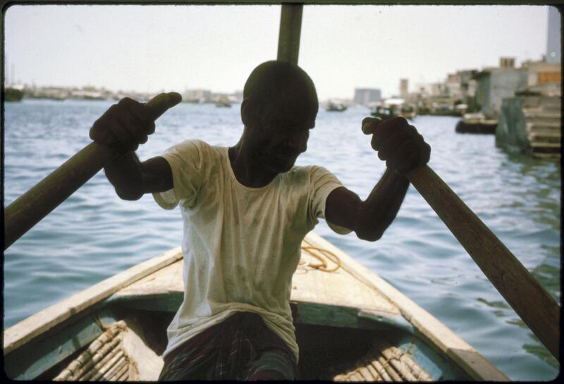 On an Abra (water taxi) being rowed across Dubai Creek in 1963. One time use - permission must be sought from desk or David  -