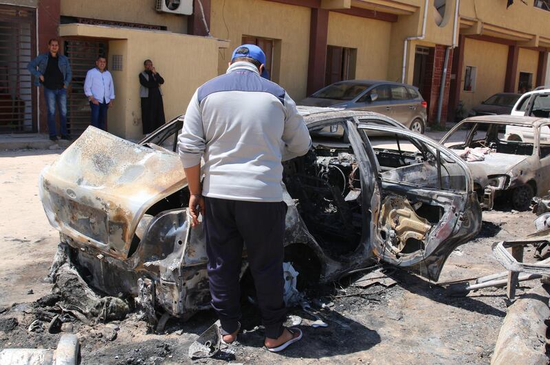 People inspect the damage after overnight shelling on the southern district of Abu Salim, Tripoli, Libya.  EPA