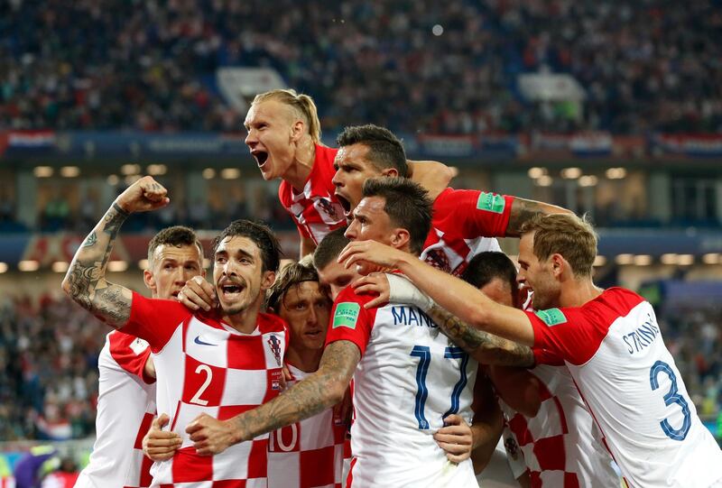 Croatia's players celebrate after teammate Luka Modric, scoring from a penalty spot during the group D match between Croatia and Nigeria at the 2018 soccer World Cup in the Kaliningrad Stadium in Kaliningrad, Russia, Saturday, June 16, 2018. (AP Photo/Petr David Josek)