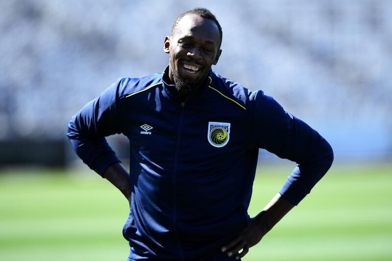 Usain Bolt smiles during a break in the session. EPA