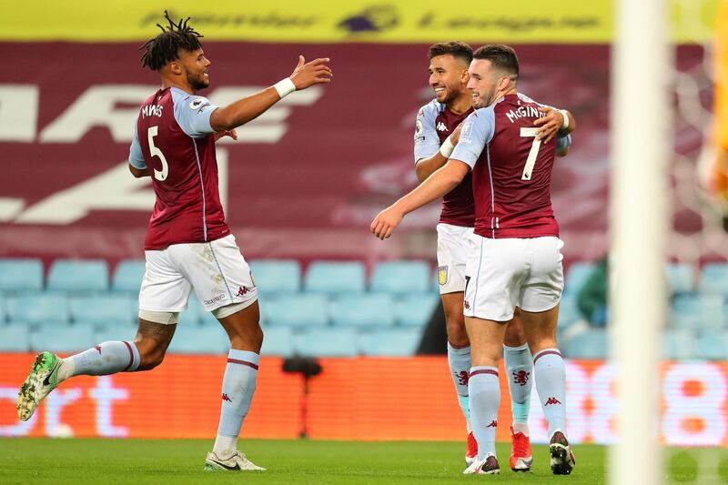 Villa midfielder John McGinn, right, celebrates with teammates after scoring their third goal. AFP