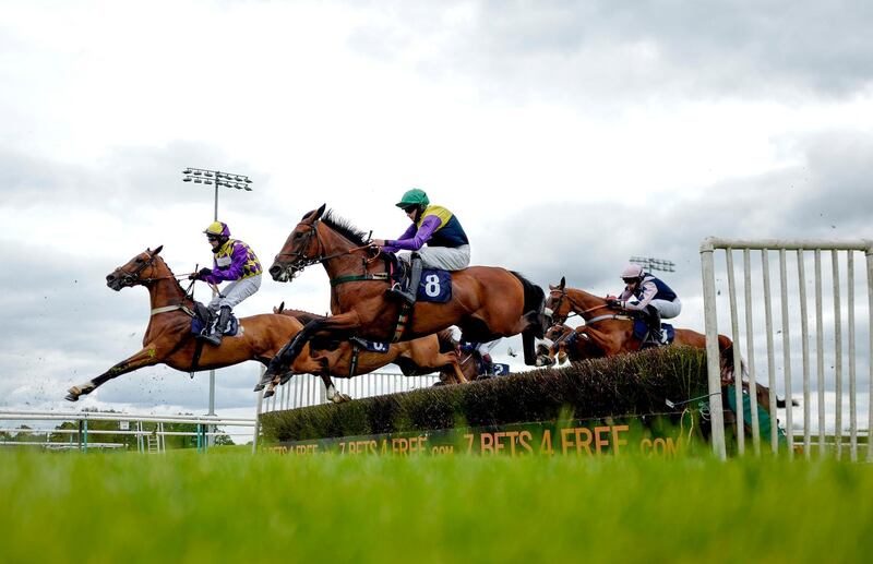 Action from the signsolutions.org Office & Interior Branding Mares' Novices' Hurdle at Southwell Racecourse on Tuesday July 14. PA