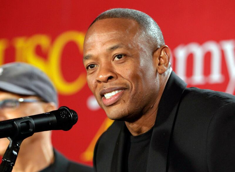 FILE - This May 15, 2013 file photo shows hip-hop mogul Dr. Dre as he announces a $70 million dollar donation to create the new "Jimmy Iovine and Andre Young Academy for Arts and Technology and Business Innovation," at the University of Southern California, in Santa Monica, Calif. Music mogul Dr. Dre was back at home Saturday, Jan 16, 2021, after being treated at a Los Angeles hospital for a reported brain aneurysm. Peter Paterno, an attorney for the rapper and producer, said Dre was home but offered no other details in an email exchange Saturday.  (AP Photo/Damian Dovarganes, File)