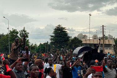 Malian soldiers are welcomed as they arrive at Independence square in Bamako on August 18, 2020. AFP