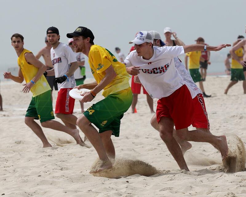 Australia (Green) and Russia (White) in action during the 2015 World Championships of Beach Ultimate (WCBU) at the JBR beach in Dubai. Satish Kumar / The National