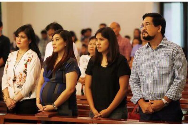 Pablo Varona, his daughters Maria Liza and Maria Lourdes and Dr Lolita Lim at St Mary's Church in Dubai.