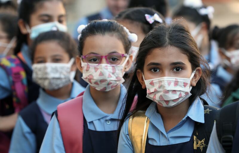 Pupils attend the first day of school at the Notre Dame school in Cairo. All photos by EPA