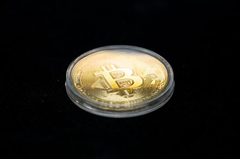 epa08115389 A Bitcoin coin is displayed at the SecuX booth at the Sands during the 2020 International Consumer Electronics Show in Las Vegas, Nevada, USA, 09 January 2020. The annual CES which takes place from 7-10 January is a place where industry manufacturers, advertisers and tech-minded consumers converge to get a taste of new innovations coming to the market each year.  EPA/ETIENNE LAURENT