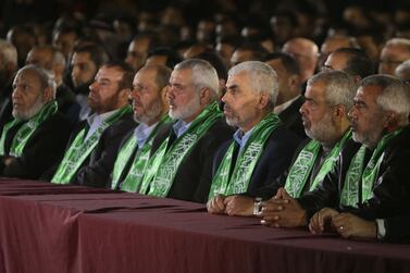 Hamas chief Ismail Haniyeh, centre, has blamed Israel for causing a deadlock in negotiations for a ceasefire in Gaza. AFP