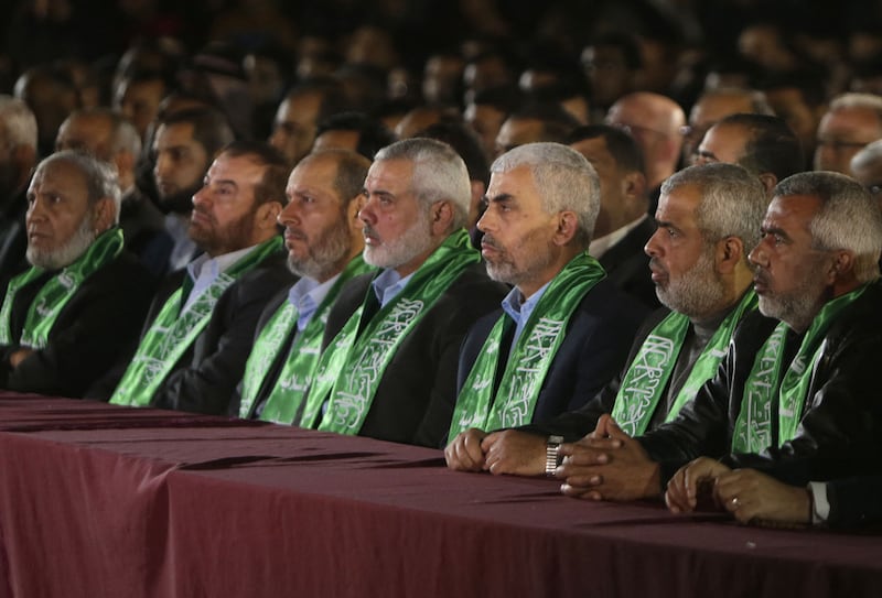 Hamas's leader in Gaza, Yahya Sinwar, third from right, and political leader Ismail Haniyeh, fourth from right. The group is under pressure to accept a US ceasefire proposal in Gaza. AFP