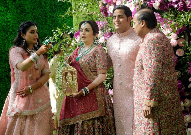 Reliance Industries Chairman Mukesh Ambani, right, his wife Nita Ambani, second left, son Akash Ambani and daughter Isha arrive for Akash's wedding in Mumbai, India, Saturday, March 9, 2019. Photo: AP