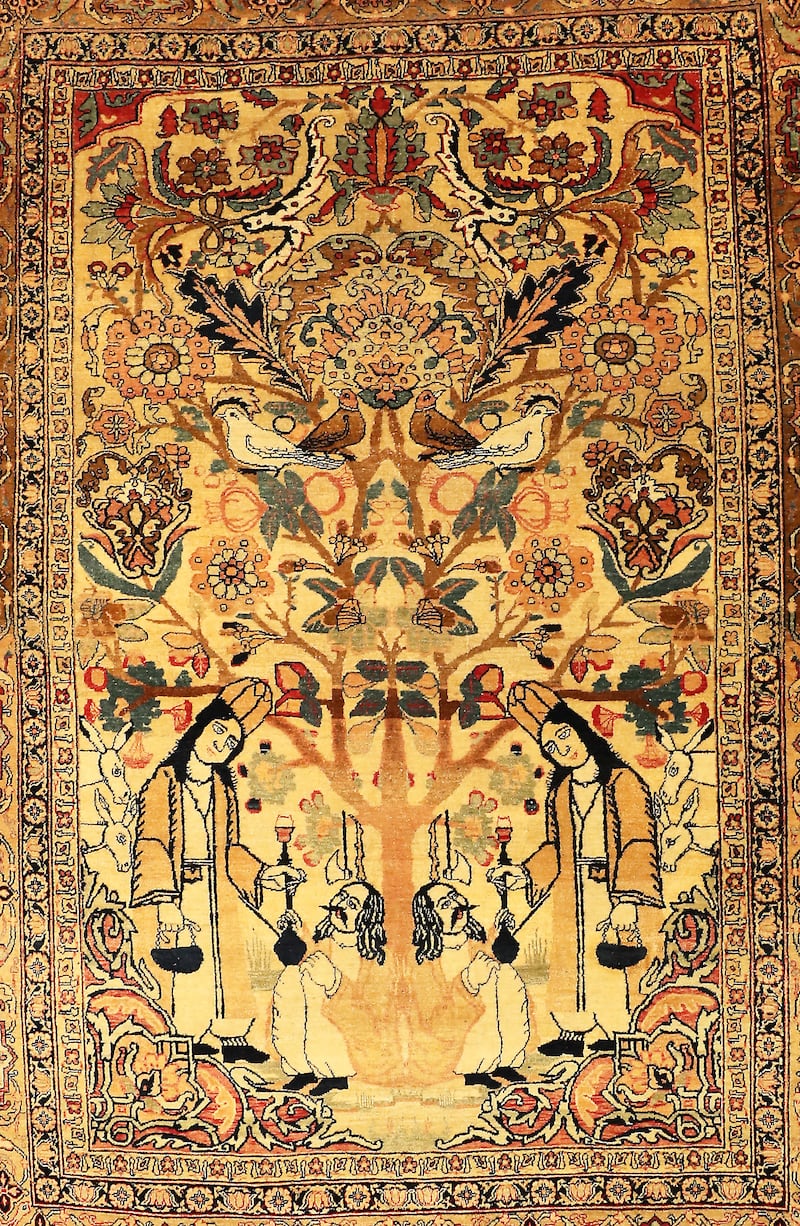A 120-year-old handmade Persian carpet with passengers and servers under a tree of birds is  $280,000.