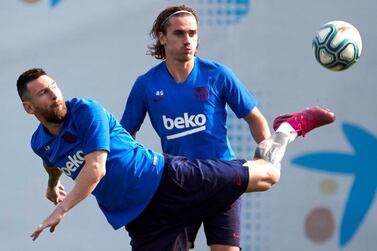 Barcelona forwards Lionel Messi, left, and Antoine Griezmann at training ahead of their La Liga match against Villarreal on Tuesday. EPA