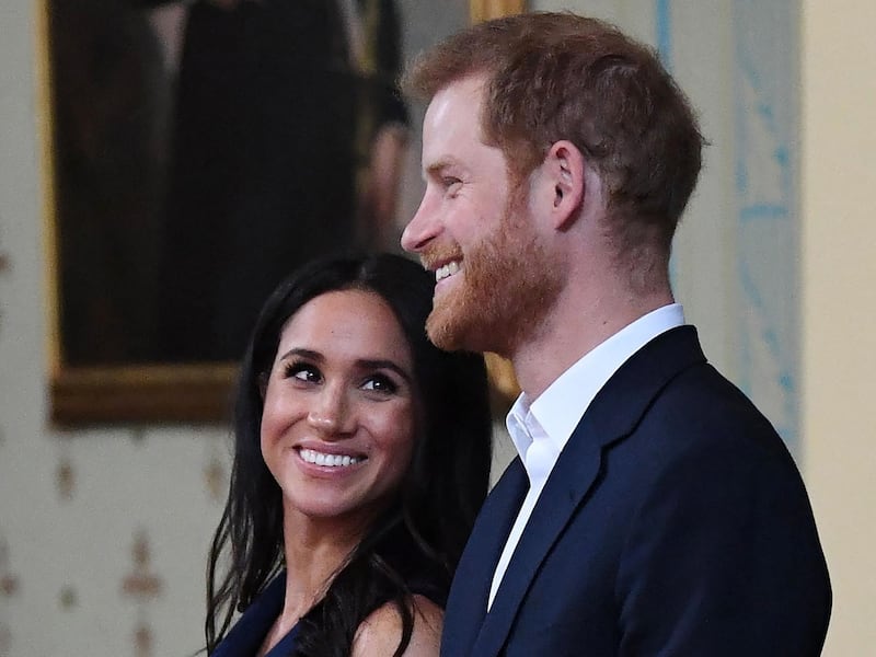 (FILES) In this file photo taken on October 18, 2018 Britain's Prince Harry and Meghan, Duchess of Sussex attend a reception at Government House in Melbourne. Prince Harry and his wife Meghan announced the birth of their daughter Lilibet Diana US media reported on May 6, 2021. / AFP / POOL / JULIAN SMITH

