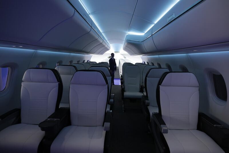 Overhead light strips illuminate the interior of a SpaceJet regional jet display cabin, manufactured by Mitsubishi Heavy Industries Ltd. Jason Alden / Bloomberg