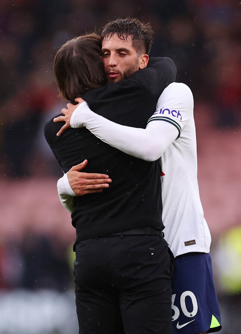 Spurs manager Antonio Conte embraces Rodrigo Bentancur after the final whistle. Getty