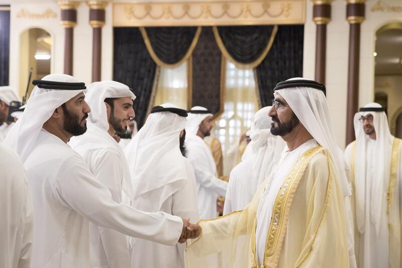 Sheikh Mohammed bin Rashid greets a guest during an Eid Al Fitr reception at Mushrif Palace. Mohamed Al Hammadi / Crown Prince Court - Abu Dhabi