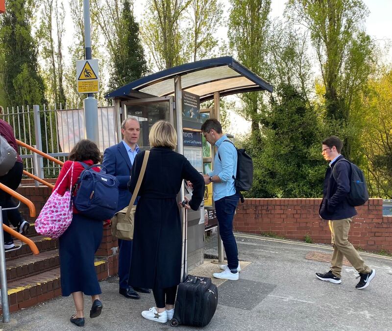 Dominic Raab speaks to commuters at Esher station during the local election campaign. @DominicRaab / Twitter