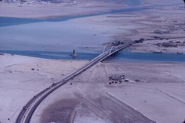 The Maqta bridge as seen from the air in 1975. Traffic is increasing, but the road to Dubai is still little more than a track