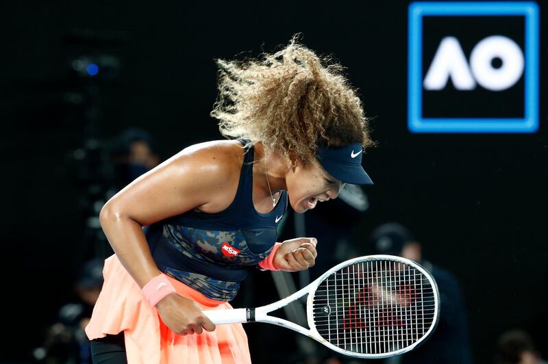 Naomi Osaka celebrates winning a point. Getty