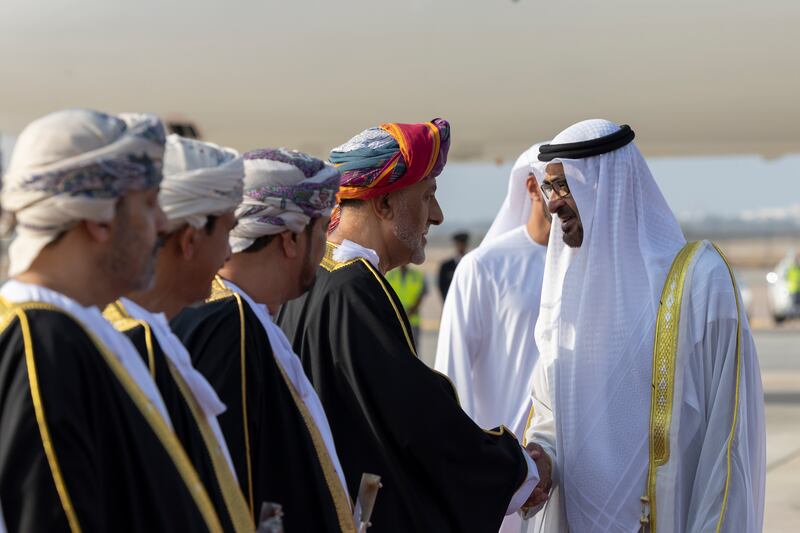 President Sheikh Mohamed greets a member of the Omani delegation. Photo: UAE Presidential Court 