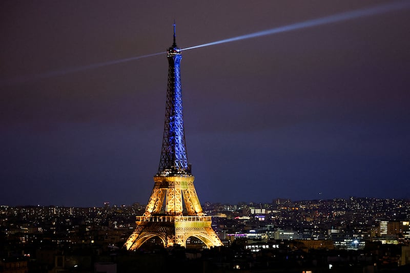 The Eiffel Tower in Paris is lit up in the blue-and-yellow colours of Ukraine. Reuters