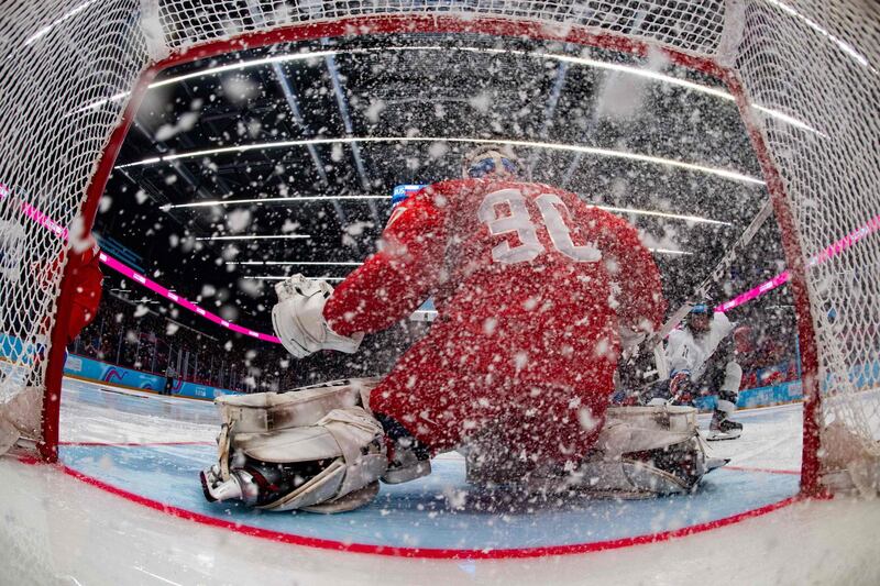 Russian netminder Sergei Ivanov saves from US player Gavin Brindley in the men's ice hockey 6-team tournament final  at Vaudoise Arena, during the 2020 Lausanne Winter Youth Olympic Games on Wednesday, January 22. Russia won the match 4-0. AFP