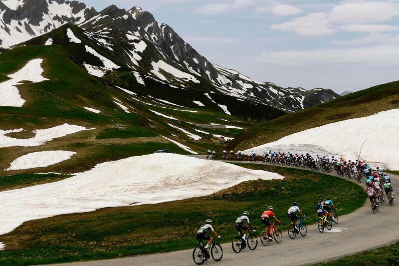 The pack rides through the Cormet de Roselend, chasing a six-man breakaway group during the seventh and last stage of the 70th edition of the Criterium du Dauphine cycling race between Moutiers and Saint-Gervais Mont-Blanc. Philippe Lopez / AFP