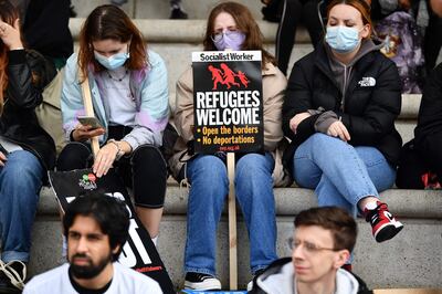 A protester holds a sign reading "Refugees Welcome" during a demonstration on the sidelines of the annual Conservative Party Conference in Manchester, north-west England, on October 3. AFP