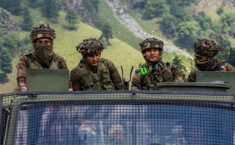 GAGANGIR, KASHMIR, INDIA - SEPTEMBER 2: Indian army convoy carrying reinforcements and supplies, drive towards Leh, on a highway bordering China, on September 2, 2020 in Gagangir, India. India and China, have stumbled once again into a bloody clash over their shared border. India rushed additional troops to Ladakh after claiming to have foiled what it called China's provocative maneuvers to change the status of Line of Actual Control, the de-facto border between the two countries, in the Himalayan region. As many as 20 Indian soldiers were killed in a "violent face-off" with Chinese troops in June this year in the Galwan Valley along the Himalayas. Chinese and Indian troops attacked each other with batons and rocks. The deadliest clash since the 1962 India-China war and both have not exchanged gunfire at the border since 1967. Since the recent clash, there has been no sign of a breakthrough. India said its soldiers were killed by Chinese troops when top commanders had agreed to defuse tensions on the Line of Actual Control, the disputed border between the two nuclear-armed neighbours. China rejected the allegations,  blaming Indian soldiers for provoking the conflict, which took place at the freezing height of 14,000 feet. The killing of soldiers has led to a call for boycott of Chinese goods in India. (Photo by Yawar Nazir/Getty Images)