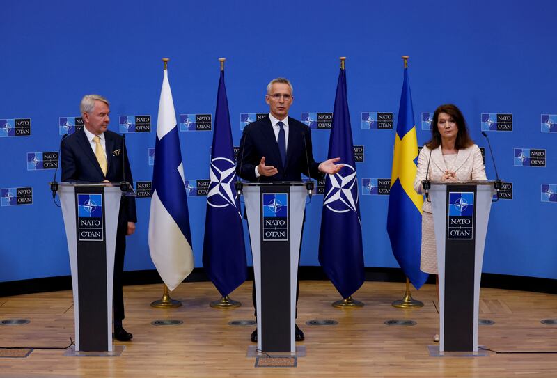 Foreign ministers Ann Linde, of Sweden, and Pekka Haavisto, of Finland, attend a news conference with Nato Secretary General Jens Stoltenberg, after signing accession protocols in Brussels. Reuters