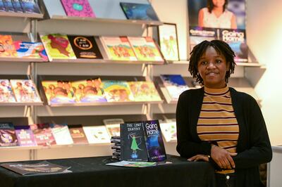 Author Kande Summers, 13, is showcasing her works at the Black Book Collective stand at the Abu Dhabi International Book Fair. Khushnum Bhandari / The National
