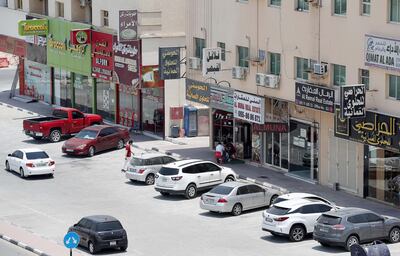 AJMAN , UNITED ARAB EMIRATES , JULY 26 – 2018 :- View of the shops on Sheikh Ammar street in Al Muwaihat area in Ajman.  ( Pawan Singh / The National )  For News. Story by Salam Al Amir
