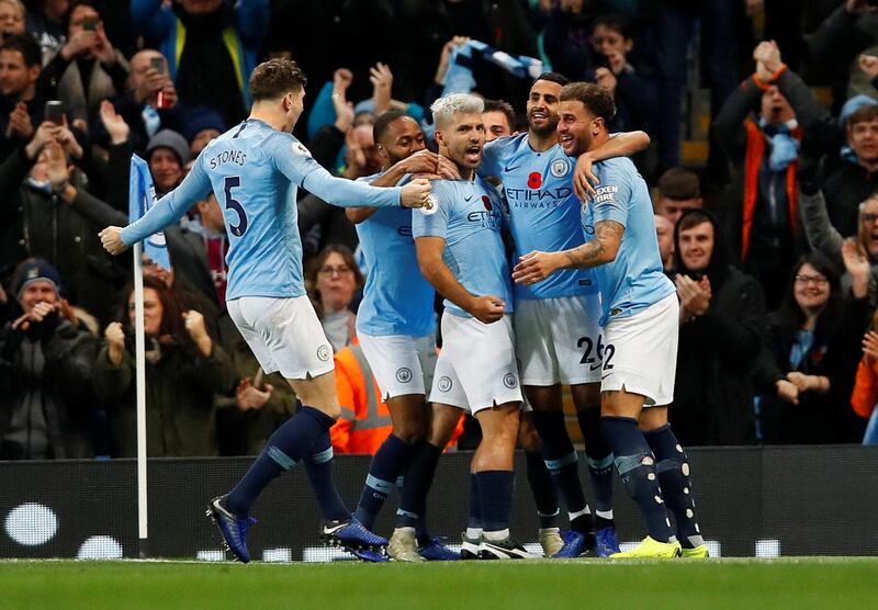 Soccer Football - Premier League - Manchester City v Manchester United - Etihad Stadium, Manchester, Britain - November 11, 2018  Manchester City's Sergio Aguero celebrates scoring their second goal with team mates   Action Images via Reuters/Jason Cairnduff  EDITORIAL USE ONLY. No use with unauthorized audio, video, data, fixture lists, club/league logos or "live" services. Online in-match use limited to 75 images, no video emulation. No use in betting, games or single club/league/player publications.  Please contact your account representative for further details.