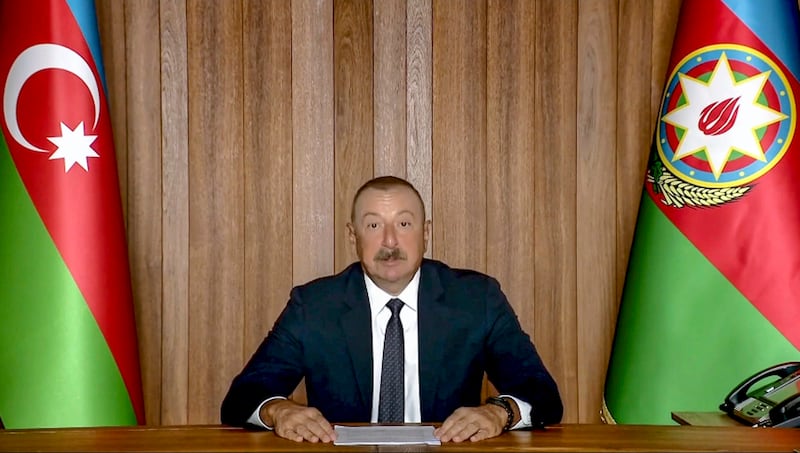 Azeri President Ilham Heydar Oglu Aliyev remotely addresses the 76th session of the UN General Assembly in a recorded message. UN Web TV via AP