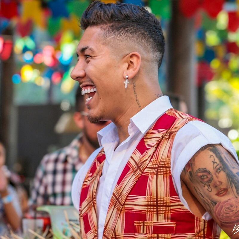 Liverpool star Roberto Firmino is as vibrant as his ear studs. Instagram / @roberto_firmino.