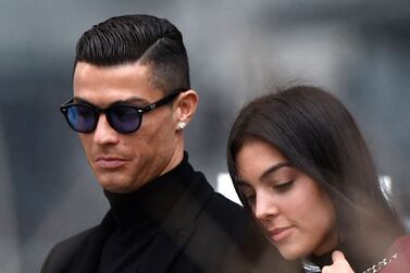 (FILES) In this file photo taken on January 22, 2019 Juventus' forward and former Real Madrid player Cristiano Ronaldo leaves with his Spanish girlfriend Georgina Rodriguez after attending a court hearing for tax evasion in Madrid.  - Cristiano Ronaldo and his partner Georgina Rodriguez announced on April 18 that their newborn baby son has died.  (Photo by OSCAR DEL POZO  /  AFP)