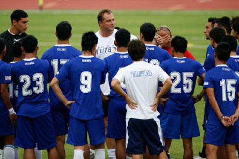 Michael Weiss, centre, the Philippines coach, will prepare his side for two games in Dubai this month. Cheryl Ravelo / Reuters